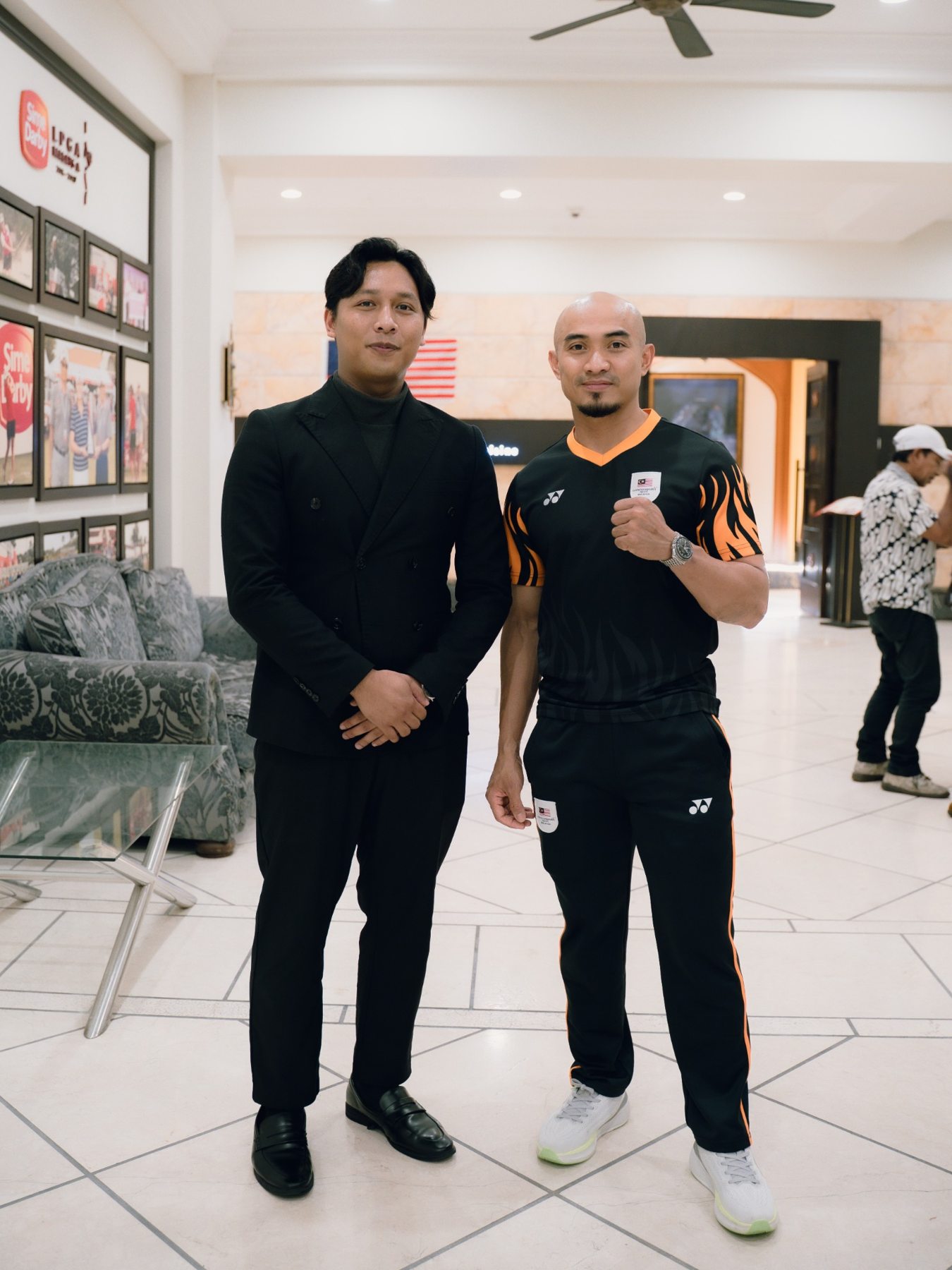Irfan in a black suit at a professional engagement