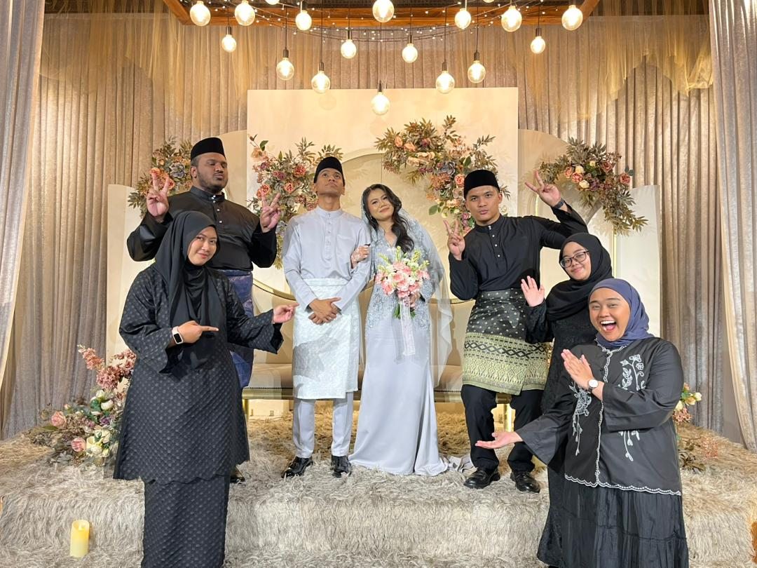 The HIAS Acara team celebrating alongside a wedding couple